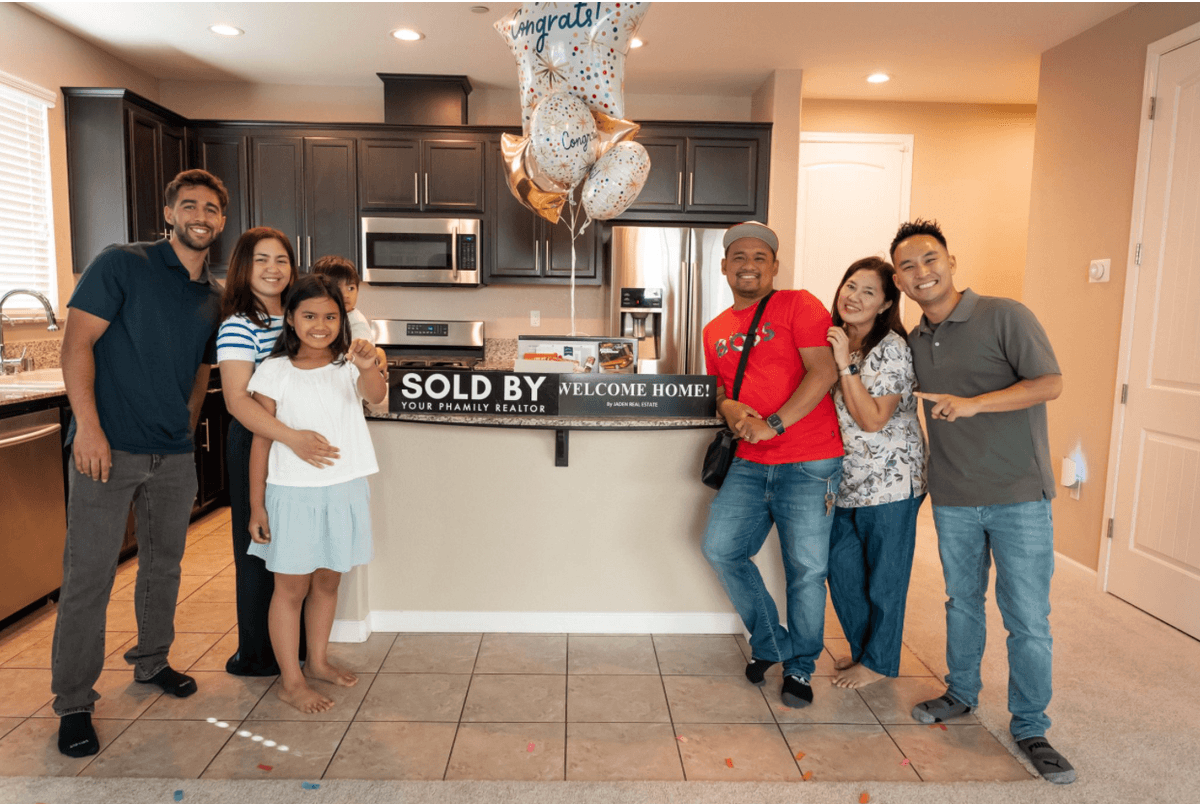 A family celebrating with Jaden in their new kitchen