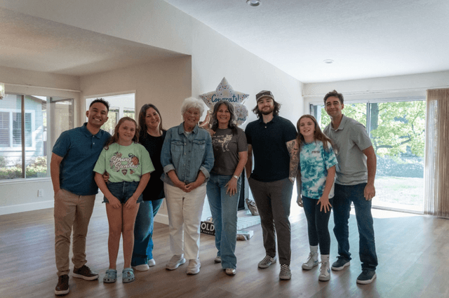A family celebrating in their new living room